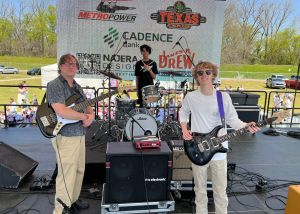 student rock band group on stage